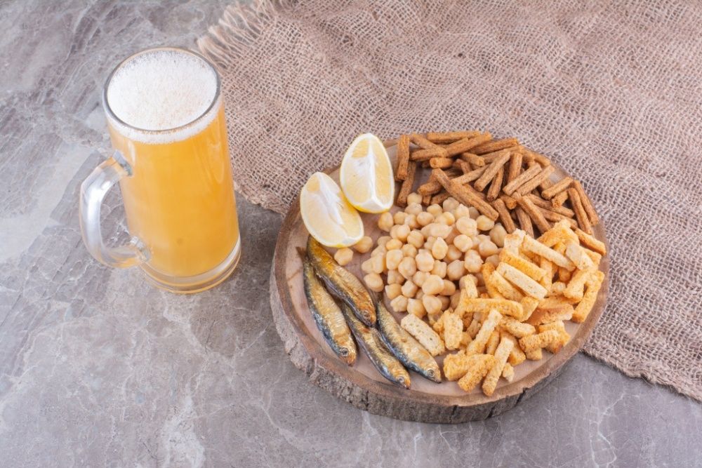various-snacks-wooden-piece-with-glass-beer-high-quality-photo.jpg